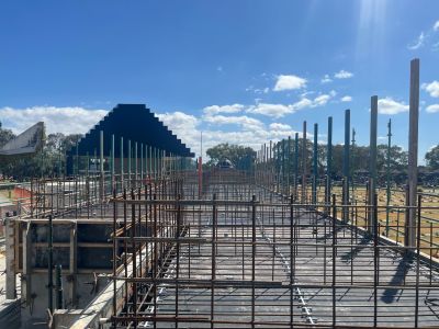 View of construction beams with the mausoleum in the background